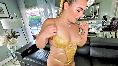 Rharri Rhound in gold lingerie with pigtails, curvy blonde posing seductively