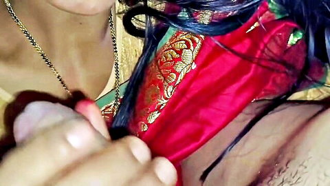 Indian woman in red saree has wet pussy spread by hairy male hand closeup