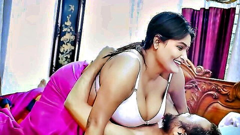 Indian curvy beauty in white bra embraces bearded man intimately
