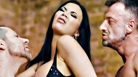 Amber Jayne in steamy threesome with two men, ecstatic expression