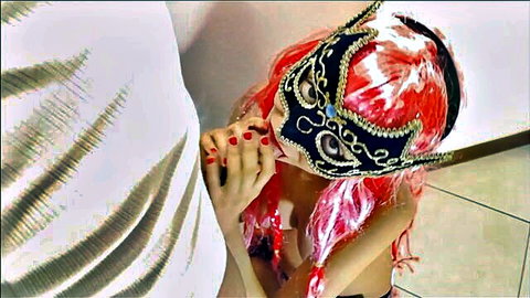 Jenny Pink in masquerade mask kneels for blowjob, pink wig and red nails