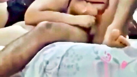 Arab MILF with big tits gropes man's cock as he fingers her pussy on bed