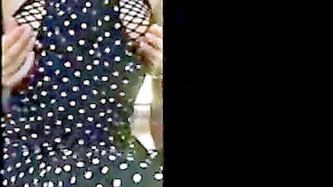 Busty white MILF lifts polka-dot top exposing huge bare tits and nipples