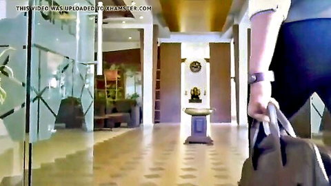 Hot Indian bhabhi walking in office hallway, teasing curves in tight outfit