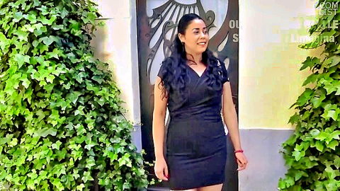 Nawel MILF in sexy black wrap dress, smiling outdoors