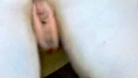 Blonde woman opens mouth wide showing thick cum load on tongue and lips