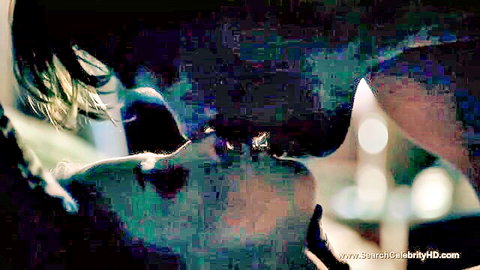 Passionate close-up kiss between Asian couple in dim night light