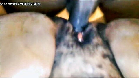 Close-up of African woman squirting during intense vaginal penetration