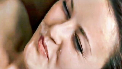 Brunette beauty's glossy face dripping with fresh cumshot on cheeks and lips post-blowjob