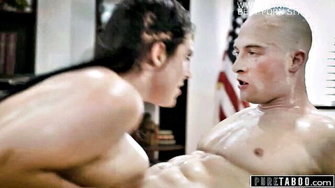 Two muscular shirtless men facing off in intense office encounter