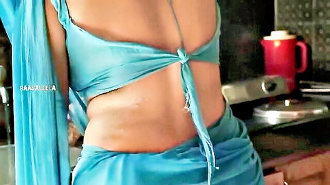 Baseela in backless blue saree blouse, exposing curvy midriff and back