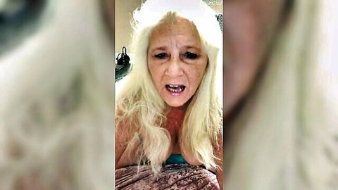 Mature blonde cougar with big bouncy tits shows deep cleavage and moans with open mouth