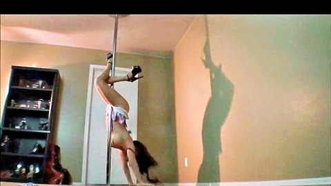 Upside-down PAWG pole dancer exposes huge hanging tits and fat ass in white thong high heels
