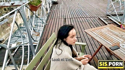 Brunette teen stepsister sits pensively on outdoor bench in shawl before sex