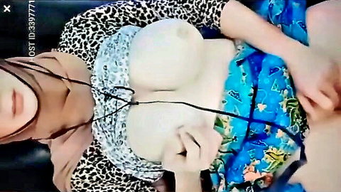 Hijab Malaysian babe exposing massive bare tits from open leopard print top