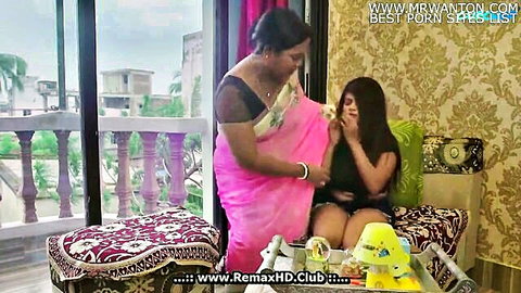 Indian aunt Nazar in pink saree seduces young girl in black top, legs spread
