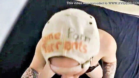 Tattooed woman in cap leaning for deepthroat action, amateur style