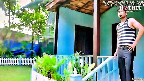 Sexy Indian man in striped tank top posing seductively on porch