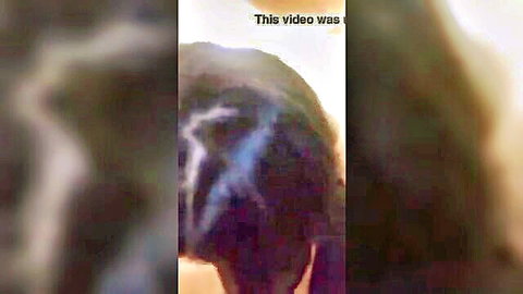 Blurry dark video frame with 'This video was' watermark overlay on indistinct shapes