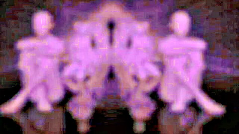 Blurry purple silhouettes of seated figures spreading legs in artistic pose
