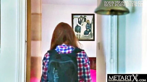 Redhead schoolgirl in plaid shirt and backpack walks into room from behind