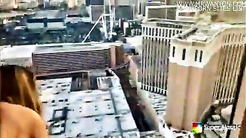 Arab cuckold in Vegas: woman with long hair on snowy rooftop overlooking city