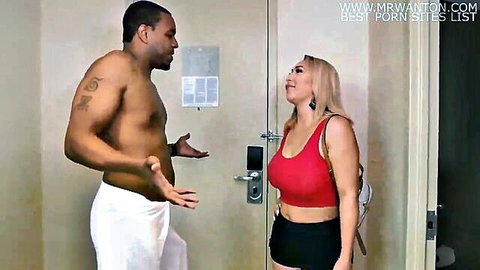 Blonde stepmom in red crop top and mini skirt chats with muscular black stepson in towel