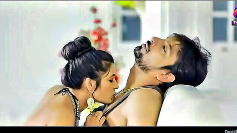 Desi Indian couple in intimate close-up, woman in black lingerie kissing shirtless man