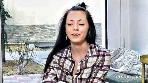Lisa M. returns in Ersties amateur video, smiling in plaid shirt