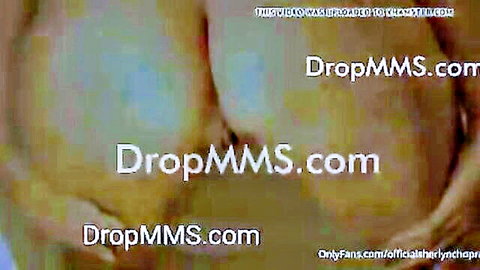 Watermarked leaked OnlyFans screenshot showing blurry nude big tits MILF