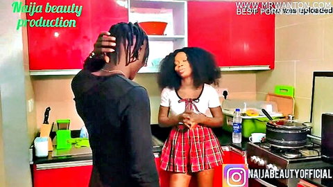 Ebony Nigerian babe in schoolgirl skirt seduced by dreadlocked boyfriend in kitchen foreplay
