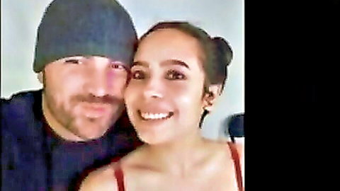 Smiling bearded man and brunette woman in red top selfie, cuckold video preview
