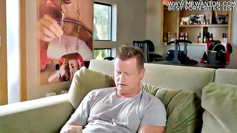 Mature dad lounging on couch in 'Daddy let me try' Kink scene