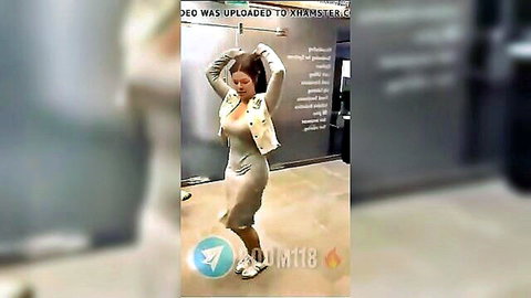 Sexy Egyptian dance solo in tight beige dress, busty brunette posing