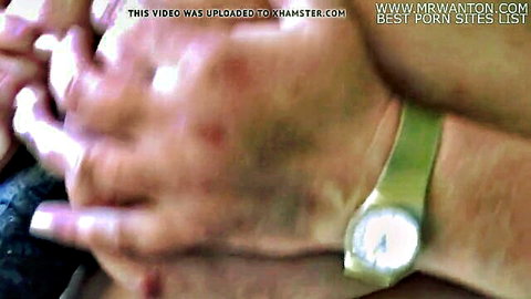 Mature woman squeezing big tits in explicit play
