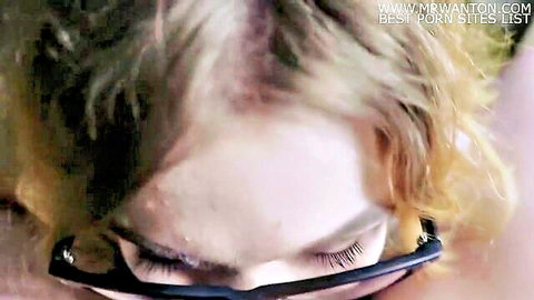 Blonde teen with glasses in sloppy oral close-up