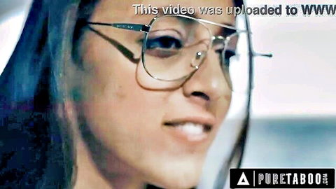 Smiling Asian woman in oversized glasses promo for PureTaboo taboo porn video