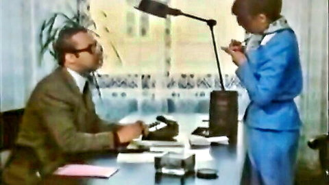Office scene with suited man and woman in professional flirtation