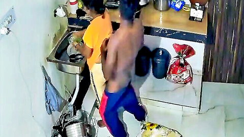 Shirtless Indian hunk bends over as friend grabs his waist in steamy kitchen tease