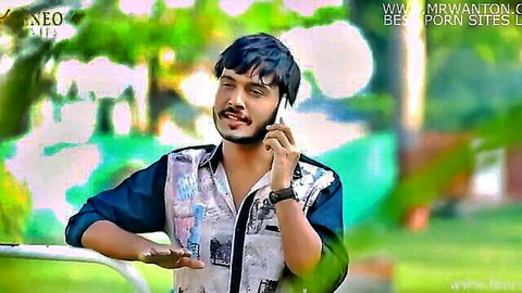 Handsome Indian man in colorful shirt talking on phone outdoors, Indian web series teaser
