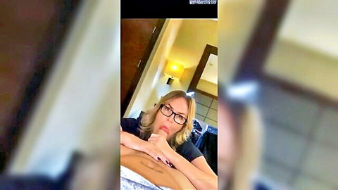 Blonde MILF with glasses leaning in for intense blowjob