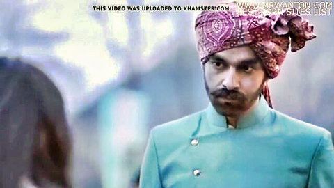 Indian man in turban and sherwani with woman in traditional dress, compelling scene
