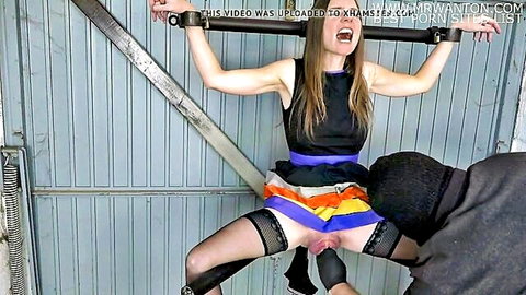 Bound brunette with big pussy spread wide on leg spreader, man eating her out