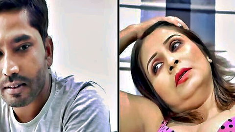 Handsome Indian man in gray t-shirt gazes at seductive South Asian woman in pink polka dot top