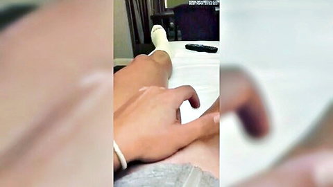 Danni Wyatt in white socks, hand teasing thighs on bed