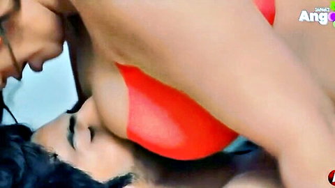Busty Indian MILF in red top presses massive tits on man's face in steamy closeup tease