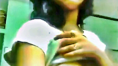 Sexy Indian brunette lifts tight white crop top teasing big underboob and cleavage on webcam