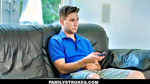 Young step-son lounging in blue polo on couch, teasing step-mom encounter