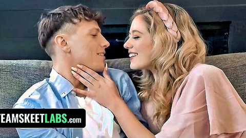 River Lynn blonde teen smiles intimately with boyfriend in pink dress