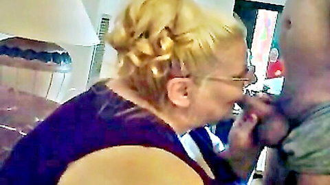 Mature blonde SSBBW wife in glasses grabs black husband's face for intimate kiss